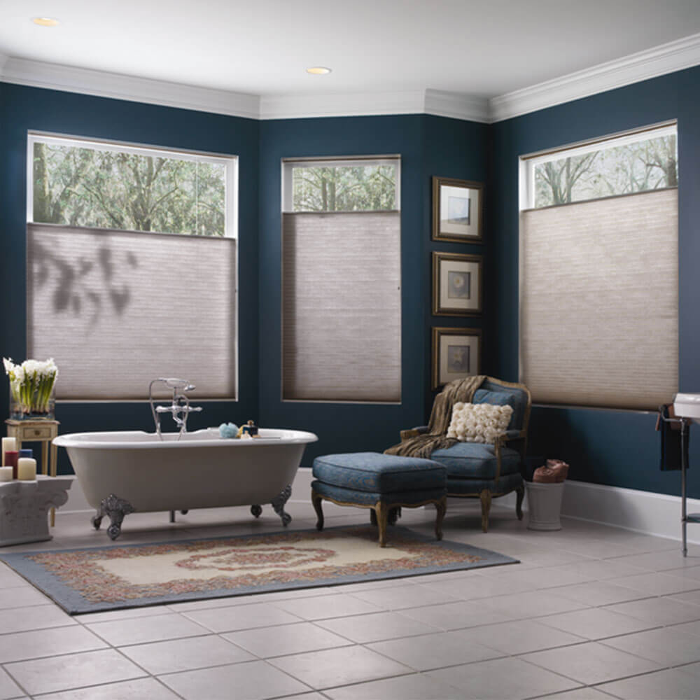 A opulent bathroom using honeycomb cellular blinds, available from The Blind Shop