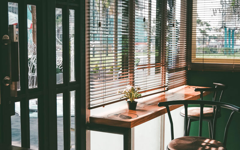Timber Ventian Blinds in a sunny canberra cafe. get yours from The Blind Shop today!