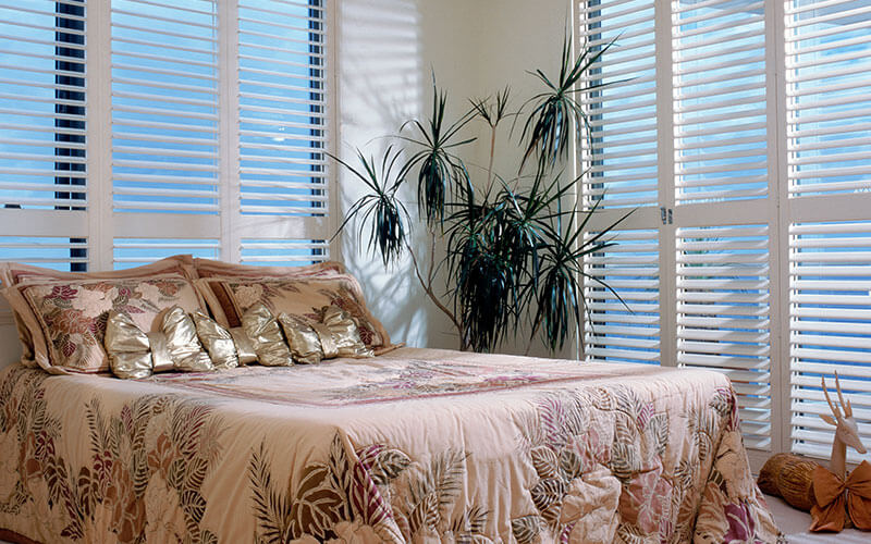 Shutters in a sunny Canberra bedroom, get yours from The Blind Shop today!